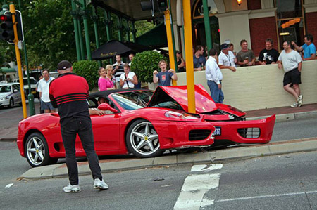 Expensive Ferrari hits traffic light